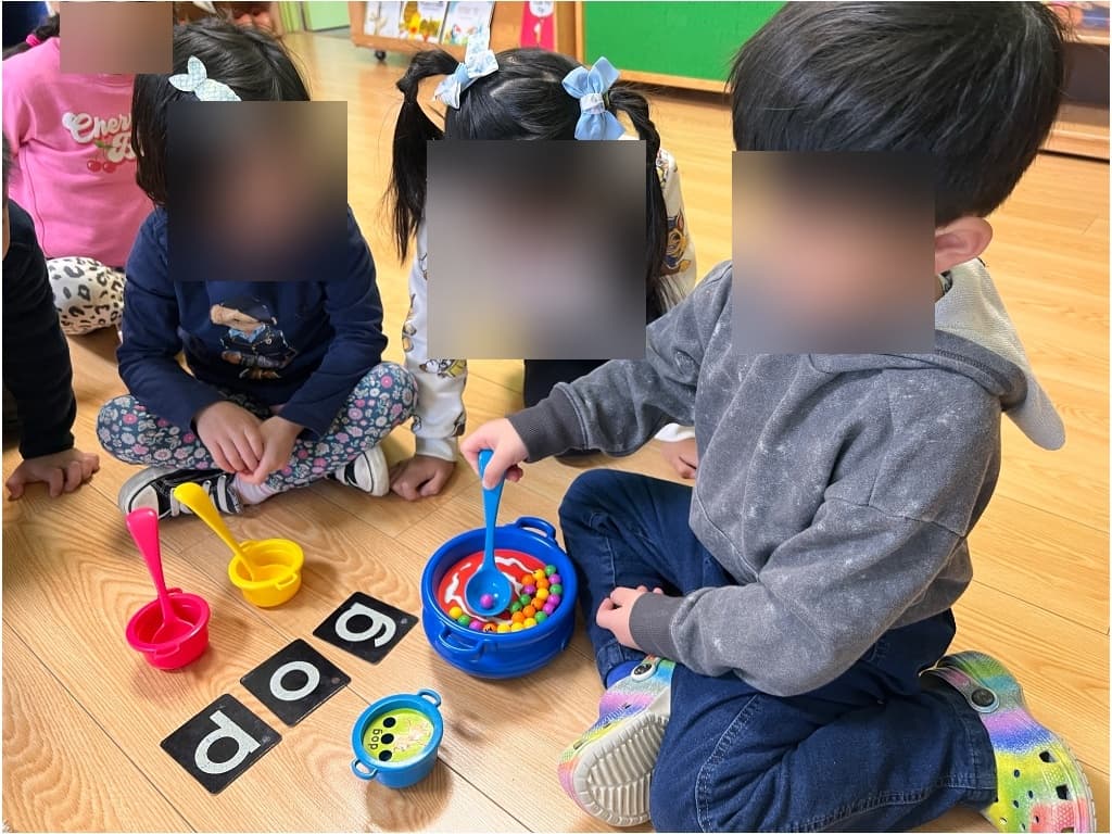 Young children creating with playdough and crafts